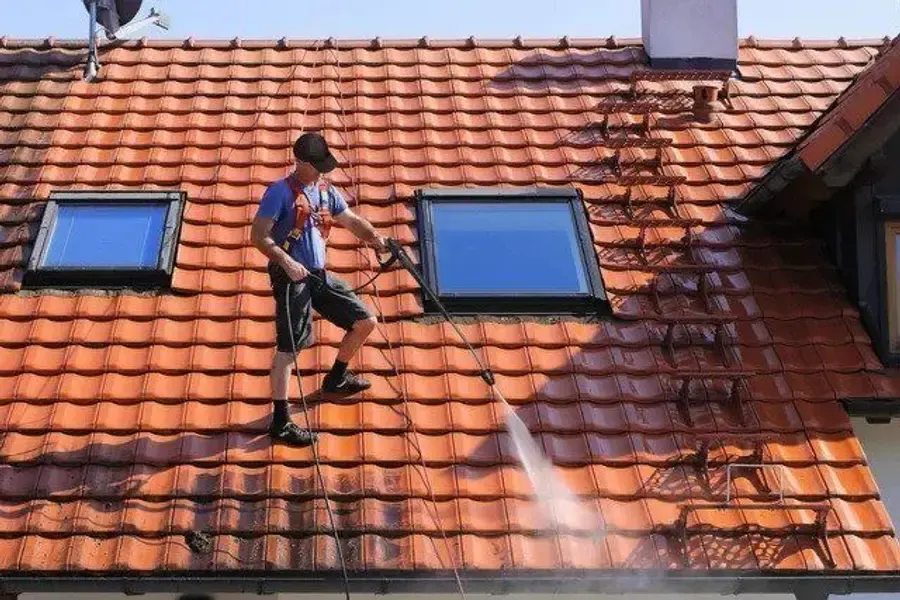 Removing loose debris from roof shingles